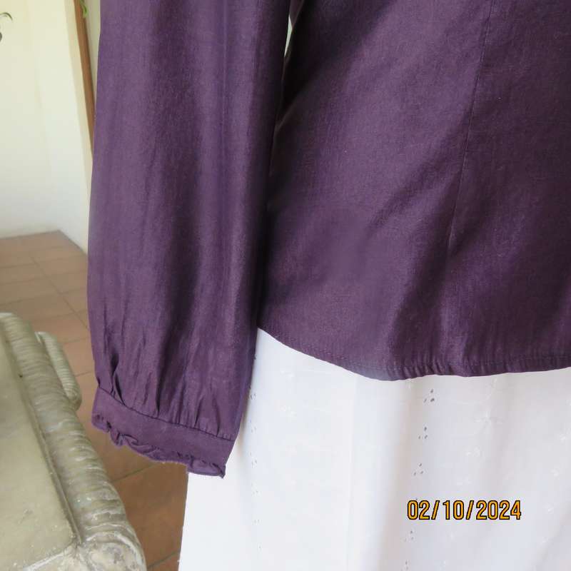 Smart shiny dark purple long sleeve tailored top size 34. V front with banded neckline.As new cond.