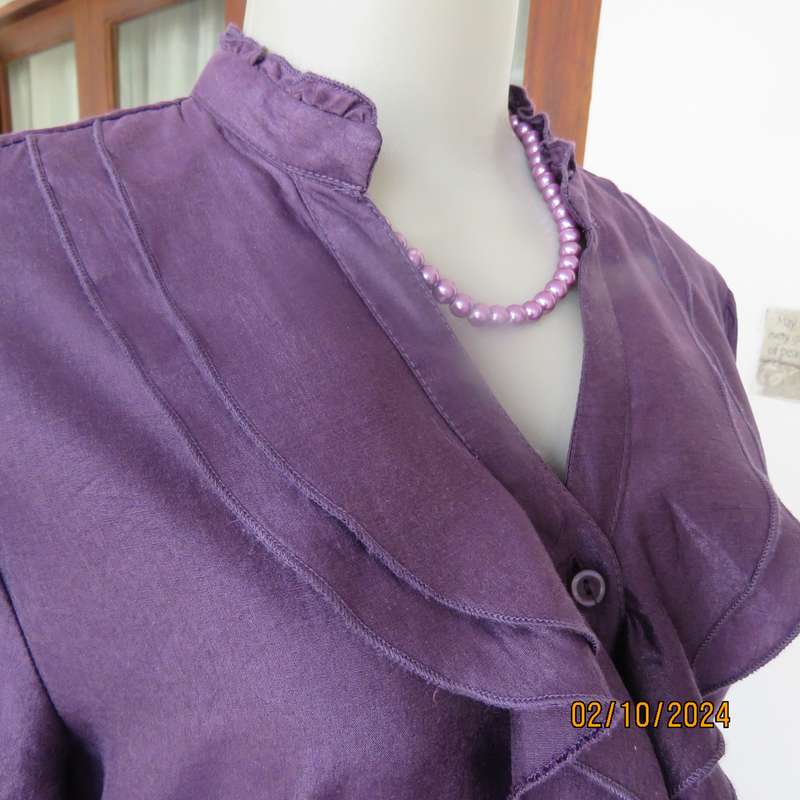 Smart shiny dark purple long sleeve tailored top size 34. V front with banded neckline.As new cond.