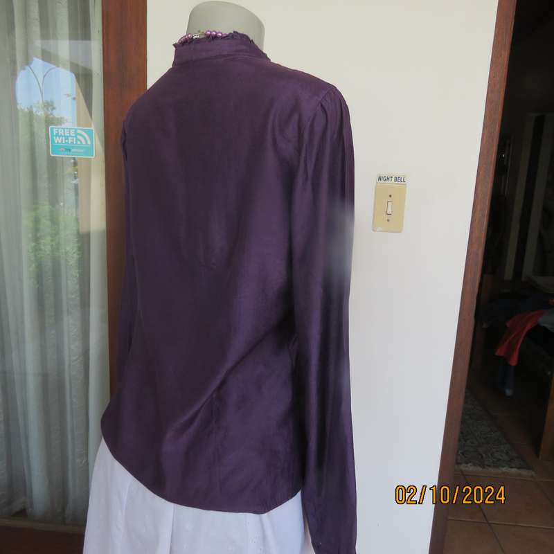 Smart shiny dark purple long sleeve tailored top size 34. V front with banded neckline.As new cond.