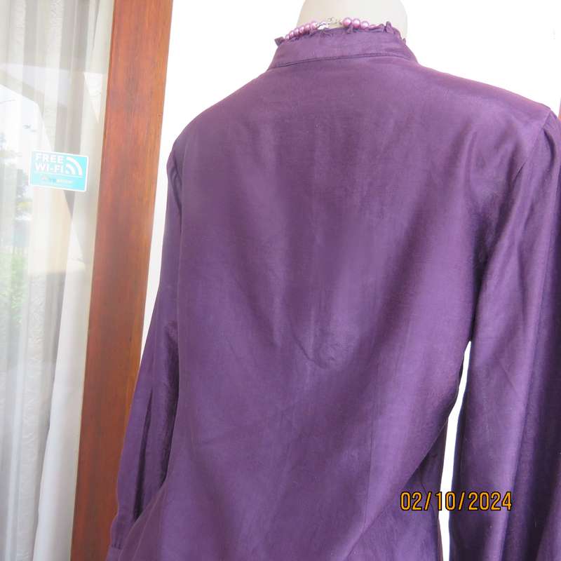 Smart shiny dark purple long sleeve tailored top size 34. V front with banded neckline.As new cond.