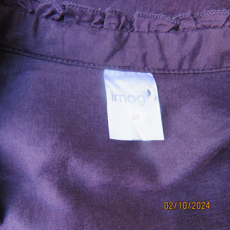 Smart shiny dark purple long sleeve tailored top size 34. V front with banded neckline.As new cond.