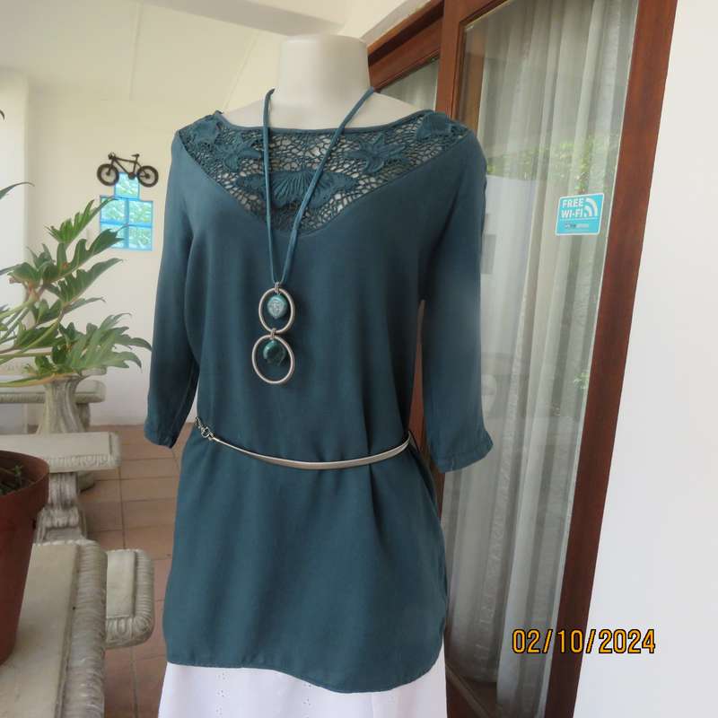 Dark jade long top with elbow length sleeves and round lace inlay neckline. Size 34.In viscose.