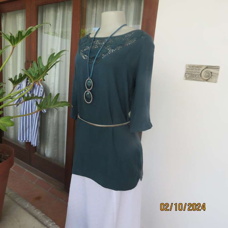 Dark jade long top with elbow length sleeves and round lace inlay neckline. Size 34.In viscose.