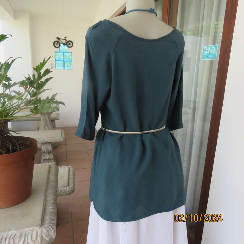 Dark jade long top with elbow length sleeves and round lace inlay neckline. Size 34.In viscose.