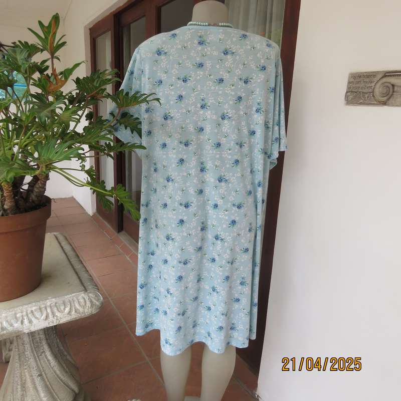 Pale turquoise with tiny blue-white floral pattern nighty. Opening on front. Size 44-46