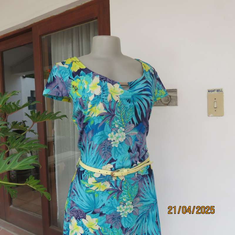 Turquoise-blue patterned stretch polyester slip over size 40 dress with yellow flowers.