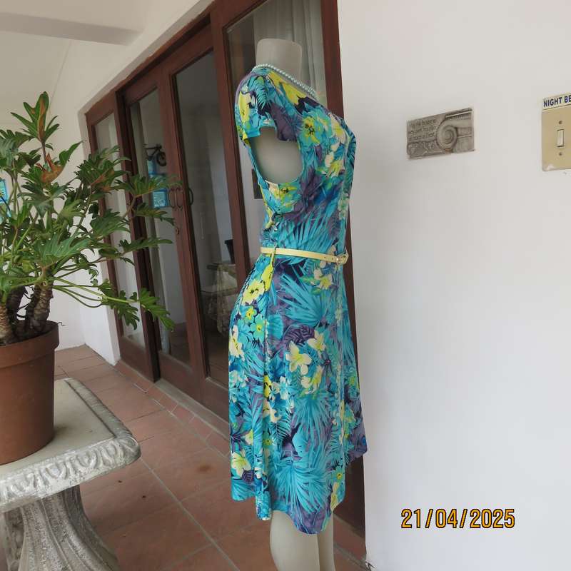 Turquoise-blue patterned stretch polyester slip over size 40 dress with yellow flowers.