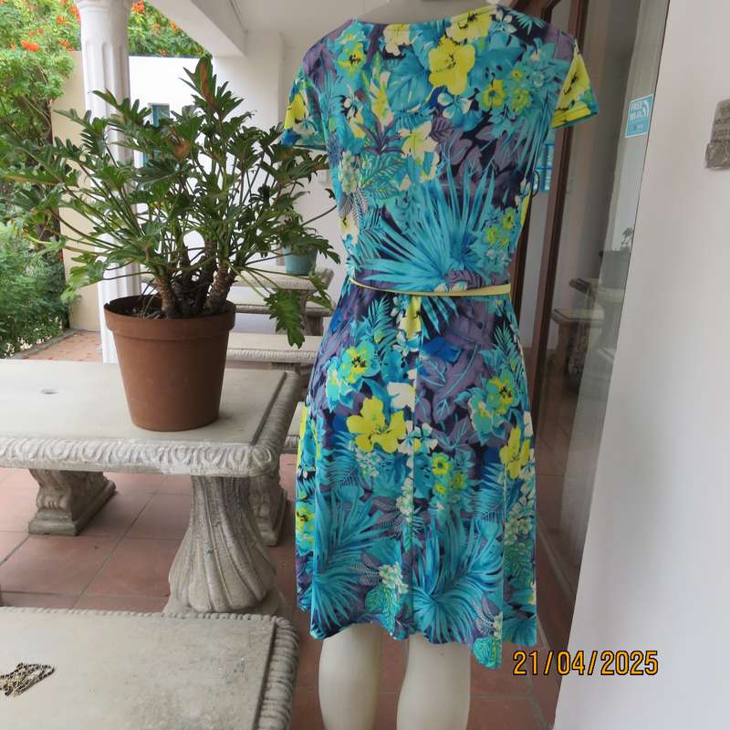 Turquoise-blue patterned stretch polyester slip over size 40 dress with yellow flowers.