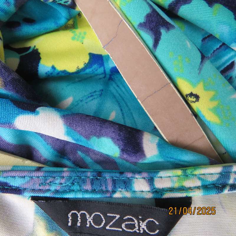 Turquoise-blue patterned stretch polyester slip over size 40 dress with yellow flowers.
