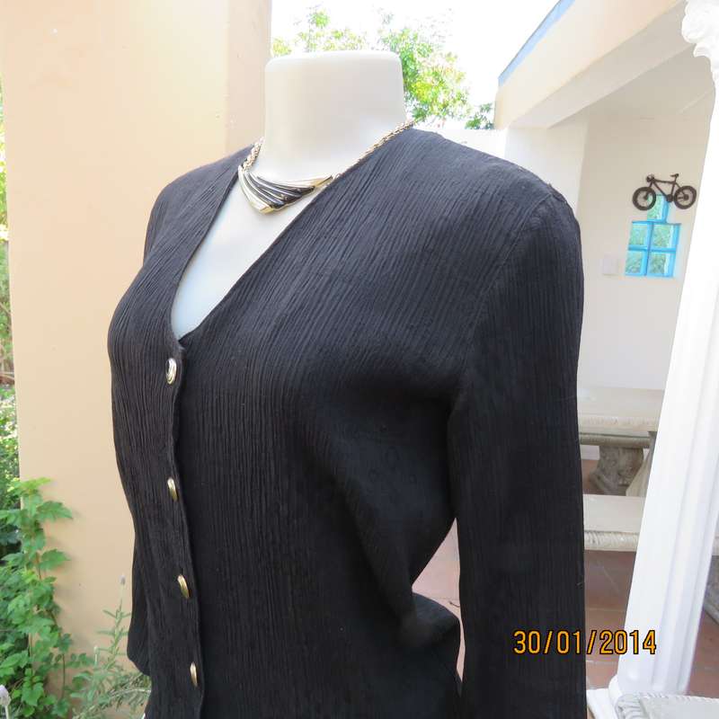Smart black V neck button down long sleeve top.In crinkled floral embossed polycotton.Size 34.As new