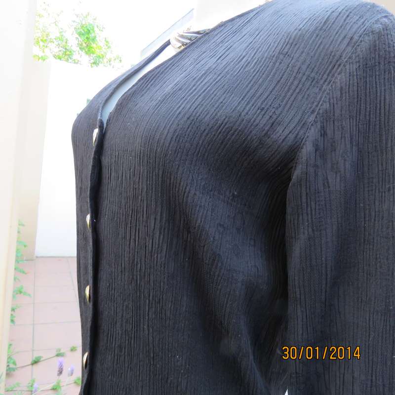 Smart black V neck button down long sleeve top.In crinkled floral embossed polycotton.Size 34.As new