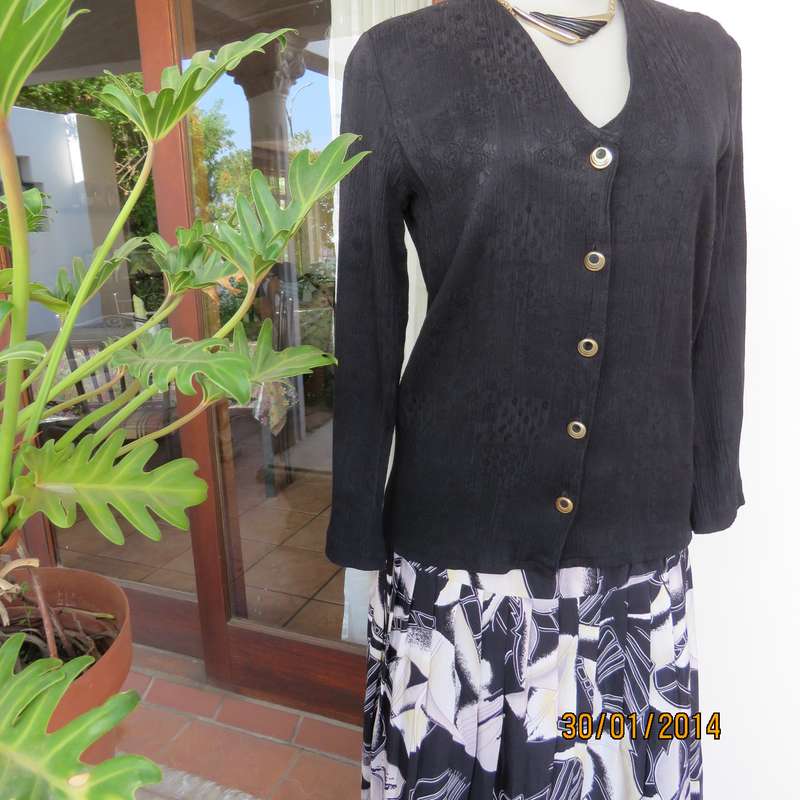 Smart black V neck button down long sleeve top.In crinkled floral embossed polycotton.Size 34.As new