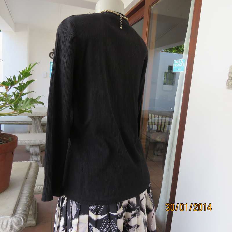 Smart black V neck button down long sleeve top.In crinkled floral embossed polycotton.Size 34.As new