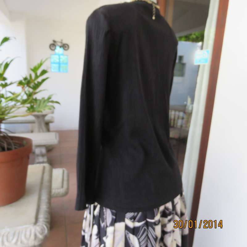 Smart black V neck button down long sleeve top.In crinkled floral embossed polycotton.Size 34.As new