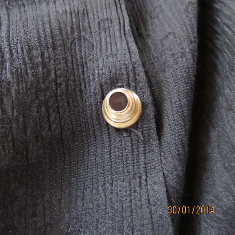 Smart black V neck button down long sleeve top.In crinkled floral embossed polycotton.Size 34.As new