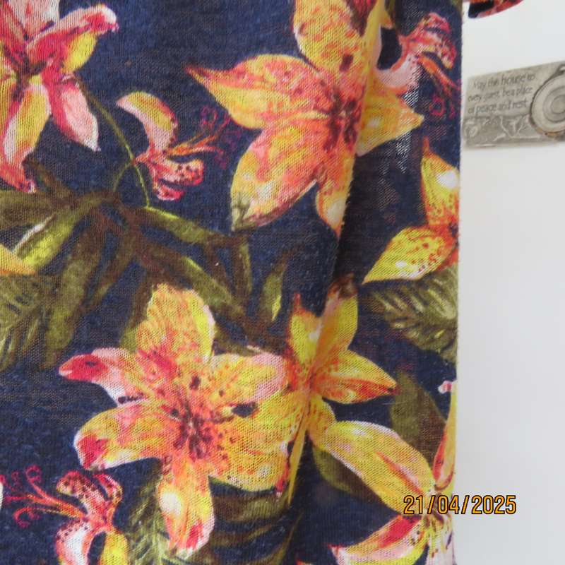 Navy off the shoulder polyester top with yellow-orange lilies. Size 44
