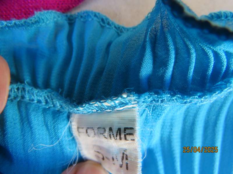 FORME teal blue permanent pleated top. Satin front inlay with frills. Size 36-38