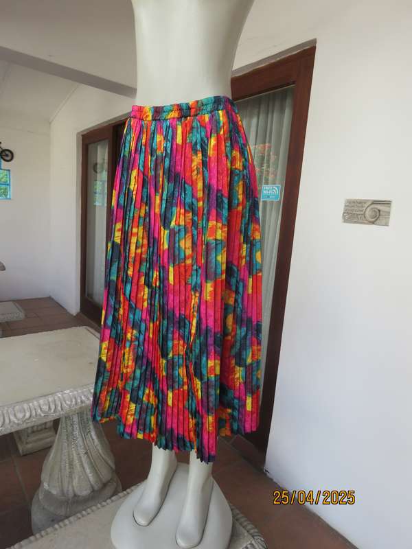Colourful graphic printed satin embossed polyester permanent pleated skirt. Size 36