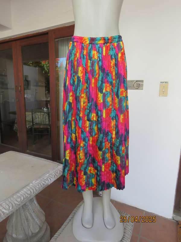 Colourful graphic printed satin embossed polyester permanent pleated skirt. Size 36