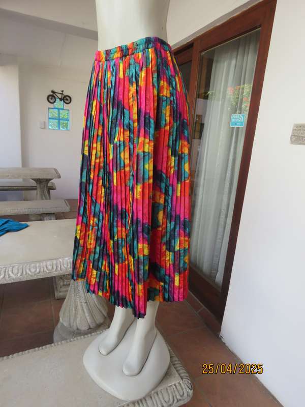 Colourful graphic printed satin embossed polyester permanent pleated skirt. Size 36