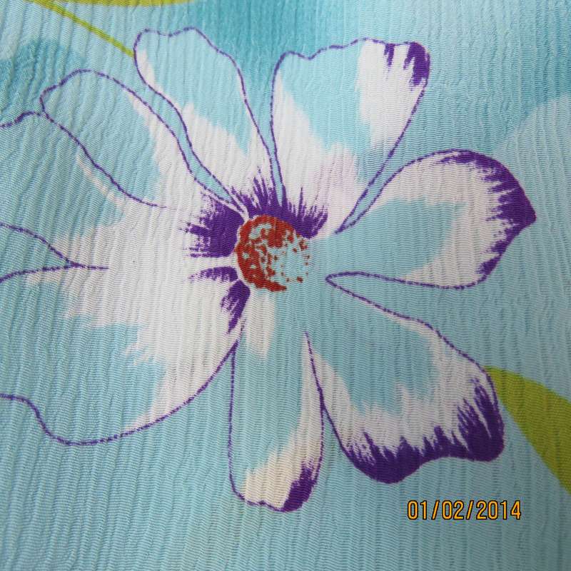 Cheerful smart short sleeve button down top in array of turquoise. Purple-orange flowers,Size 40.