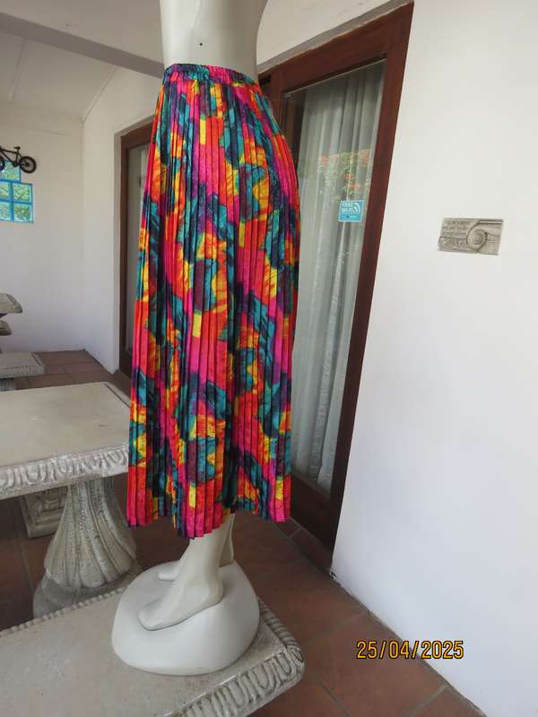 Colourful graphic printed satin embossed polyester permanent pleated skirt. Size 36