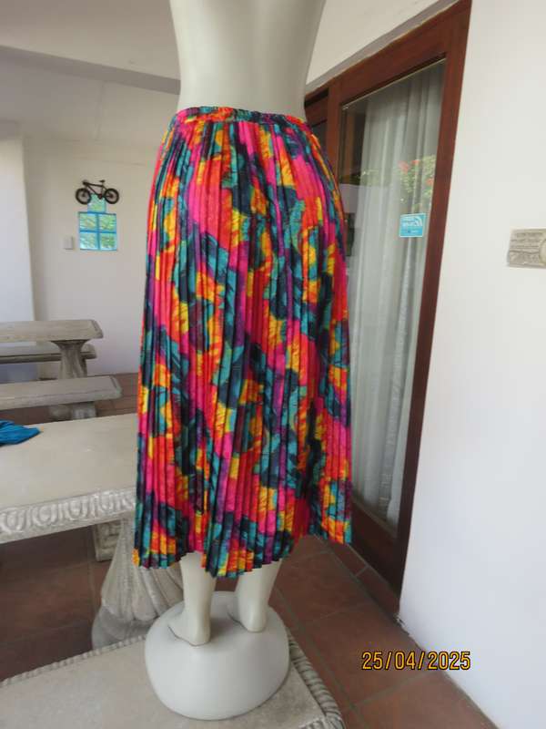 Colourful graphic printed satin embossed polyester permanent pleated skirt. Size 36