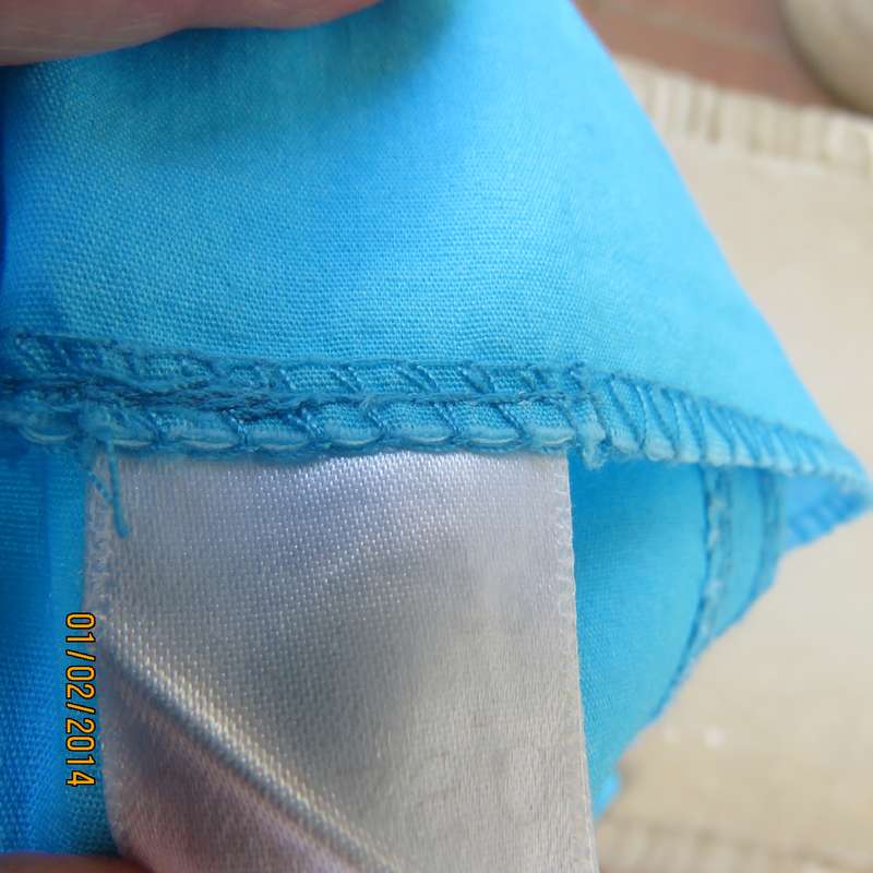 Easy to wear godet tropical turquoise colour skirt.Bandless with side zip.Size 38.As new condition.