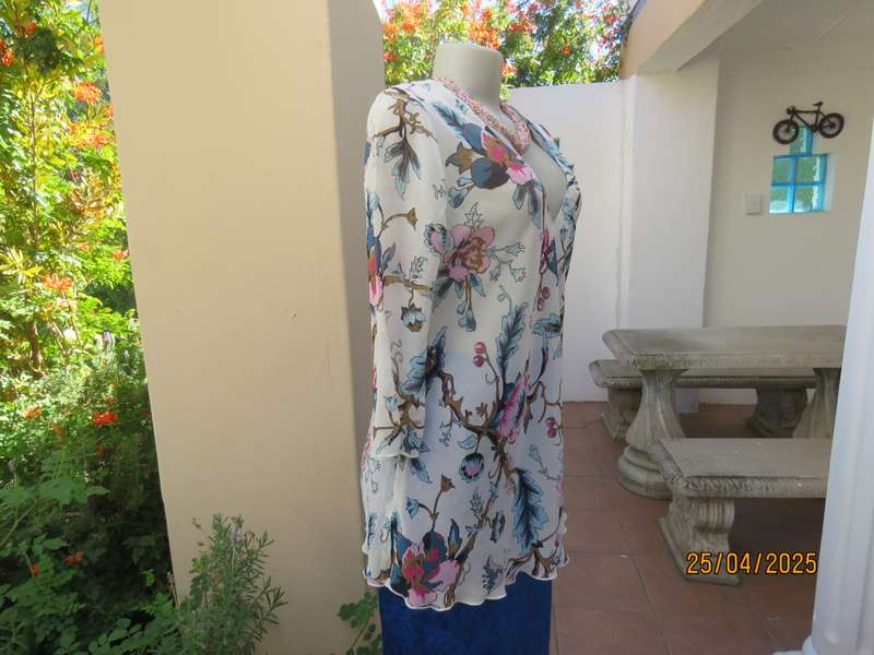 EXACT slip over white sheer polyester with blue-pink flowers. V neck. Size 36.