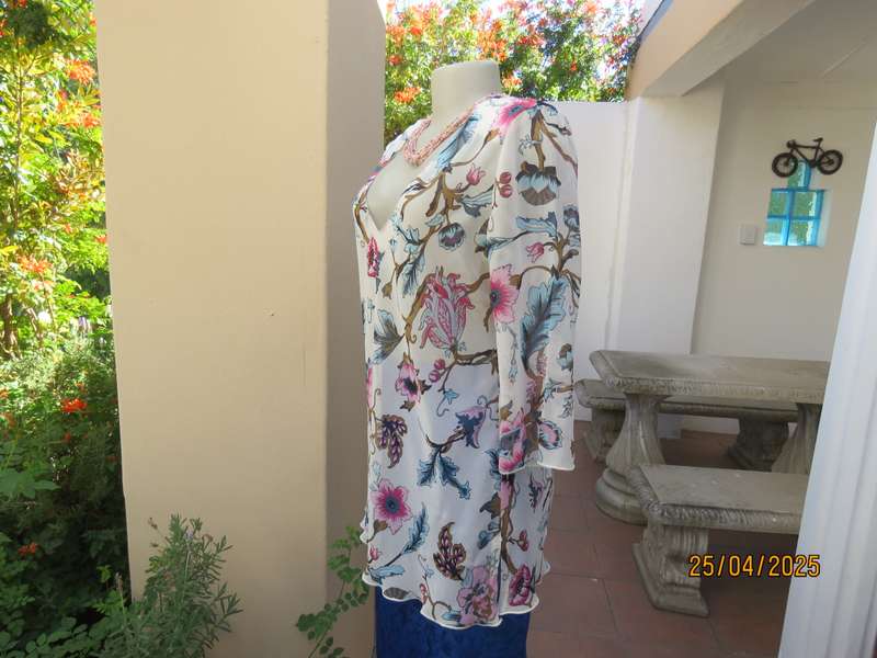 EXACT slip over white sheer polyester with blue-pink flowers. V neck. Size 36.