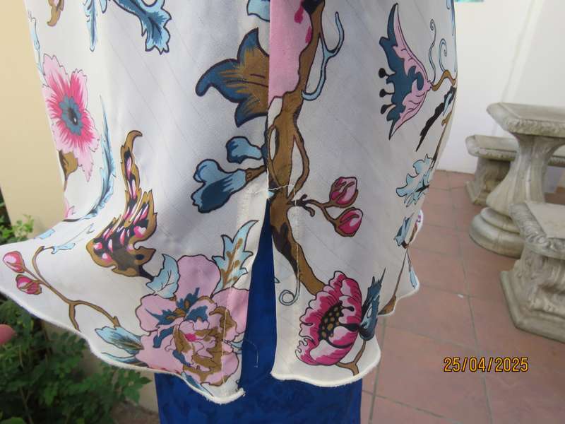 EXACT slip over white sheer polyester with blue-pink flowers. V neck. Size 36.
