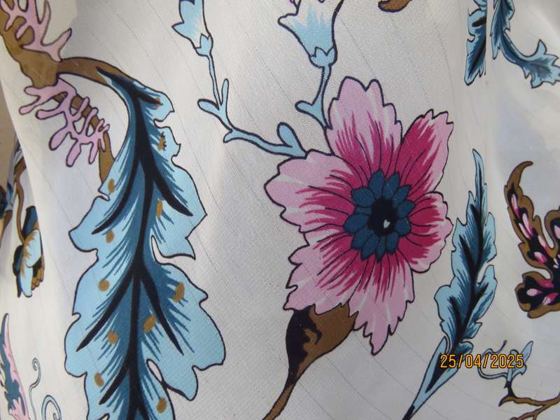 EXACT slip over white sheer polyester with blue-pink flowers. V neck. Size 36.
