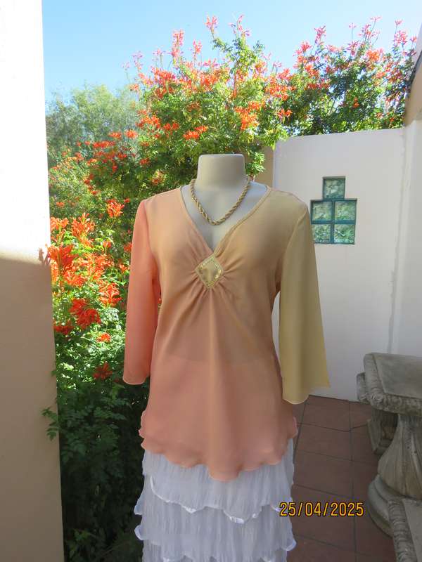 Slip over top in shades of peach colours with decoration on front. Size 36.