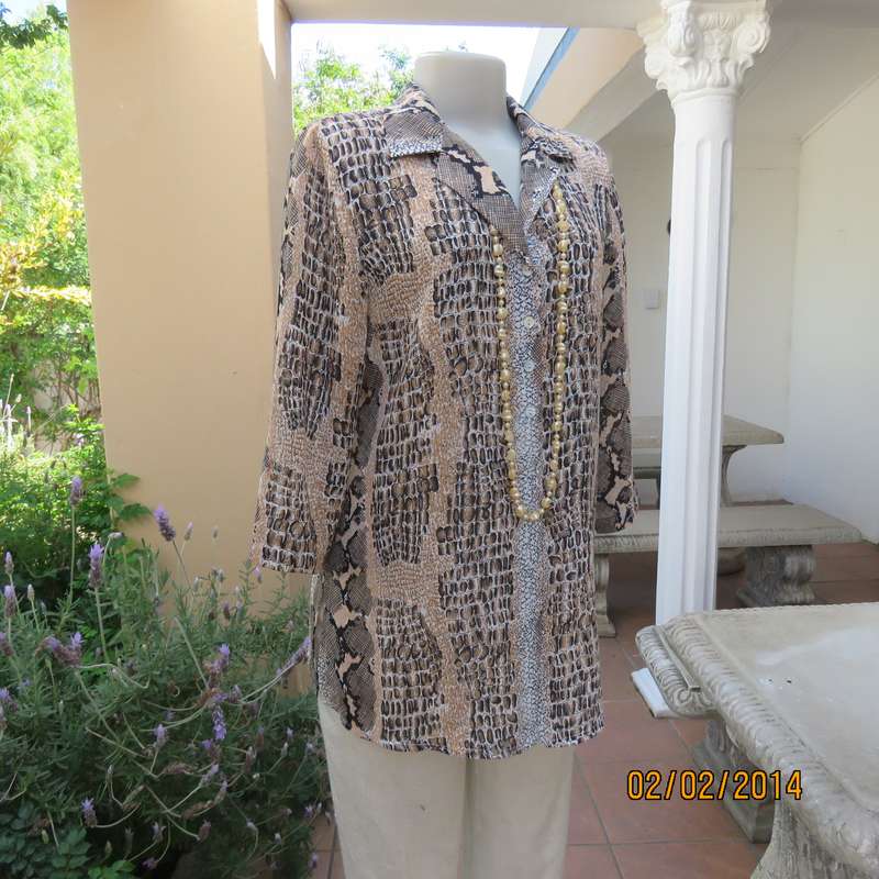 Elegant animal print polyester top size 36. Beige-peach and black. Bracelet length sleeves. As new