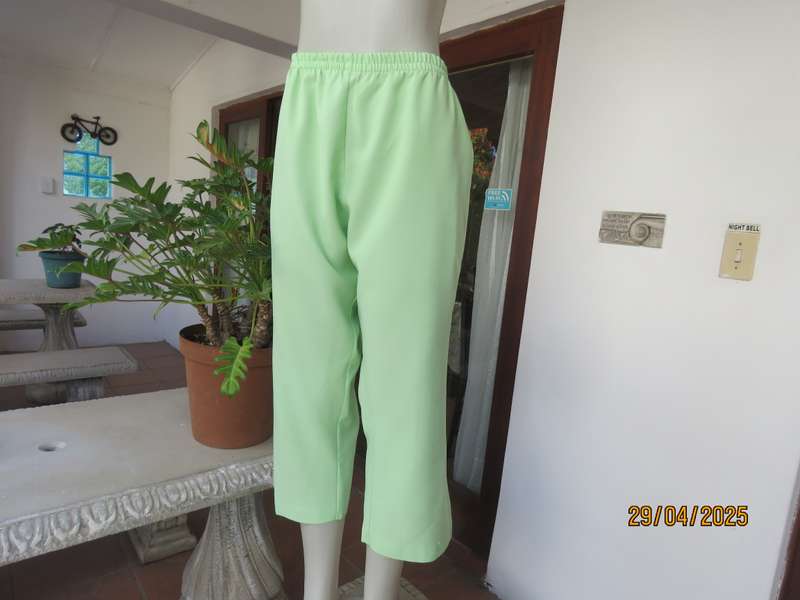 Mint green polyester ankle length pants size 42 with elasticated waist.