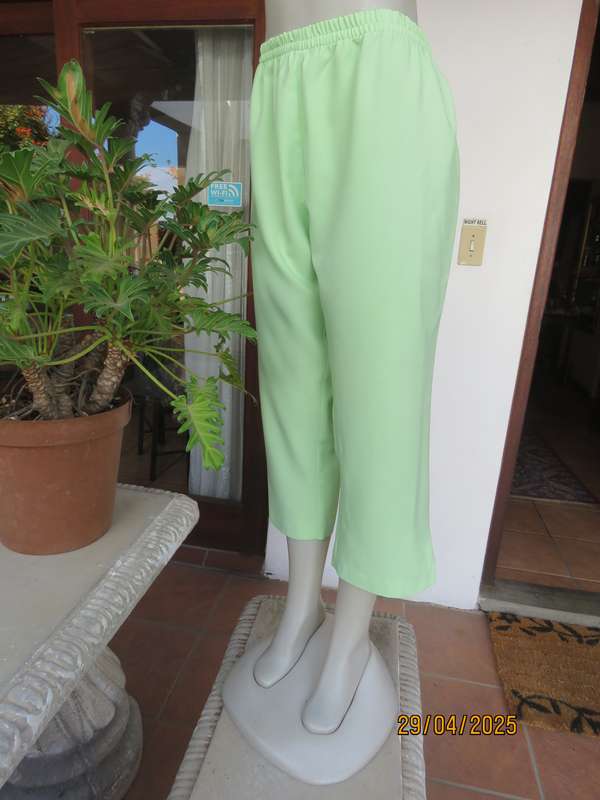Mint green polyester ankle length pants size 42 with elasticated waist.