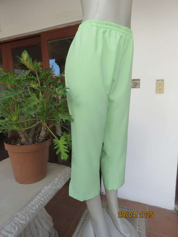 Mint green polyester ankle length pants size 42 with elasticated waist.