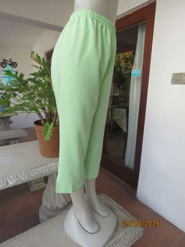 Mint green polyester ankle length pants size 42 with elasticated waist.