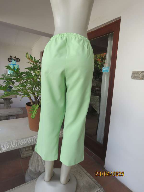 Mint green polyester ankle length pants size 42 with elasticated waist.
