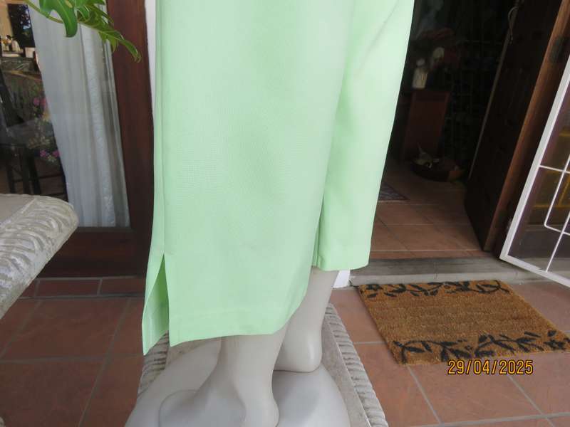 Mint green polyester ankle length pants size 42 with elasticated waist.