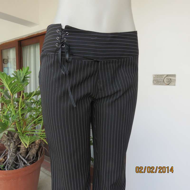 Smart black-white pinstripe bootcut polyester pants size 34. Yoked waistband with braiding. As new.