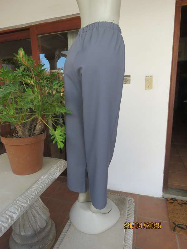 Boutique made hailstorm grey 100% polyester with elasticated waist. Size 40
