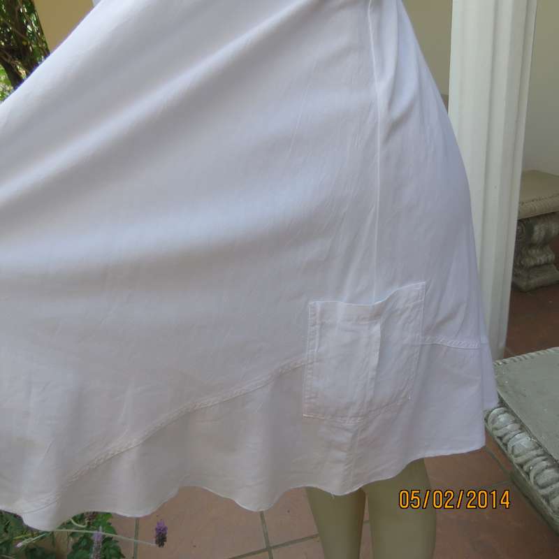 As new white slightly creased 100% cotton strappy dress. Size 36.Elasticated waist.Half flare skirt.