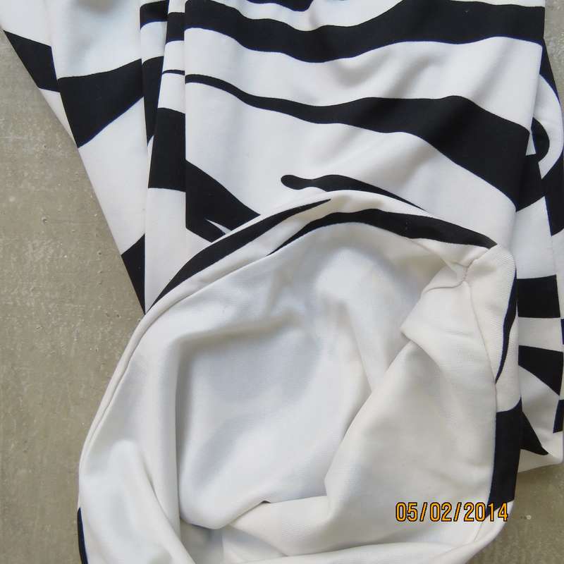 Fabulous black-white animal print stretch polyester XS dress.Size 28.Two layers. Pleats in waist.RT.