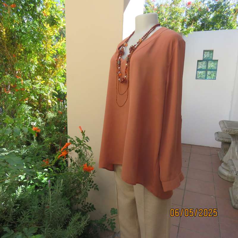 PENNY C dark coral colour long cuffed sleeve V neck top. Size 48-24. As new.