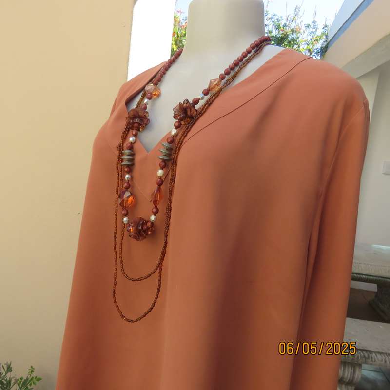 PENNY C dark coral colour long cuffed sleeve V neck top. Size 48-24. As new.