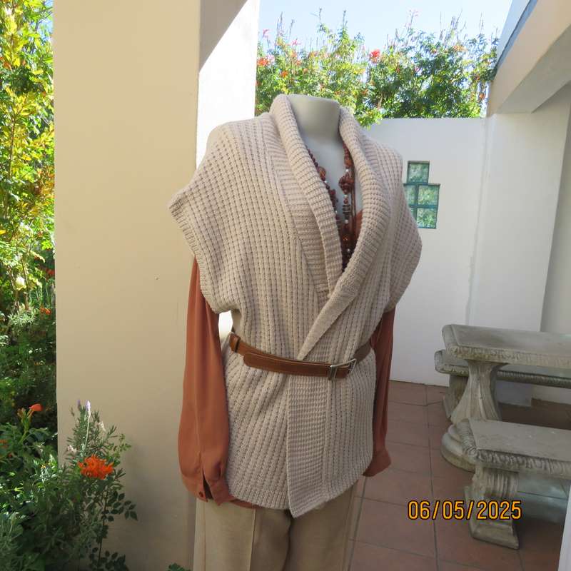 Beige fold over acrylic knit waistcoat style top. Front rib stitch. Size 42. As new.