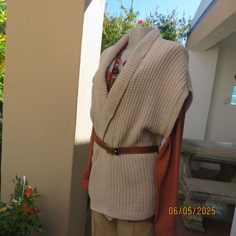 Beige fold over acrylic knit waistcoat style top. Front rib stitch. Size 42. As new.