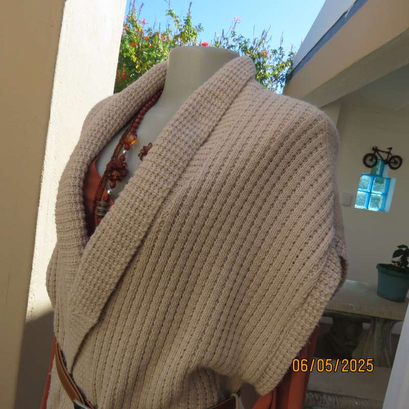 Beige fold over acrylic knit waistcoat style top. Front rib stitch. Size 42. As new.