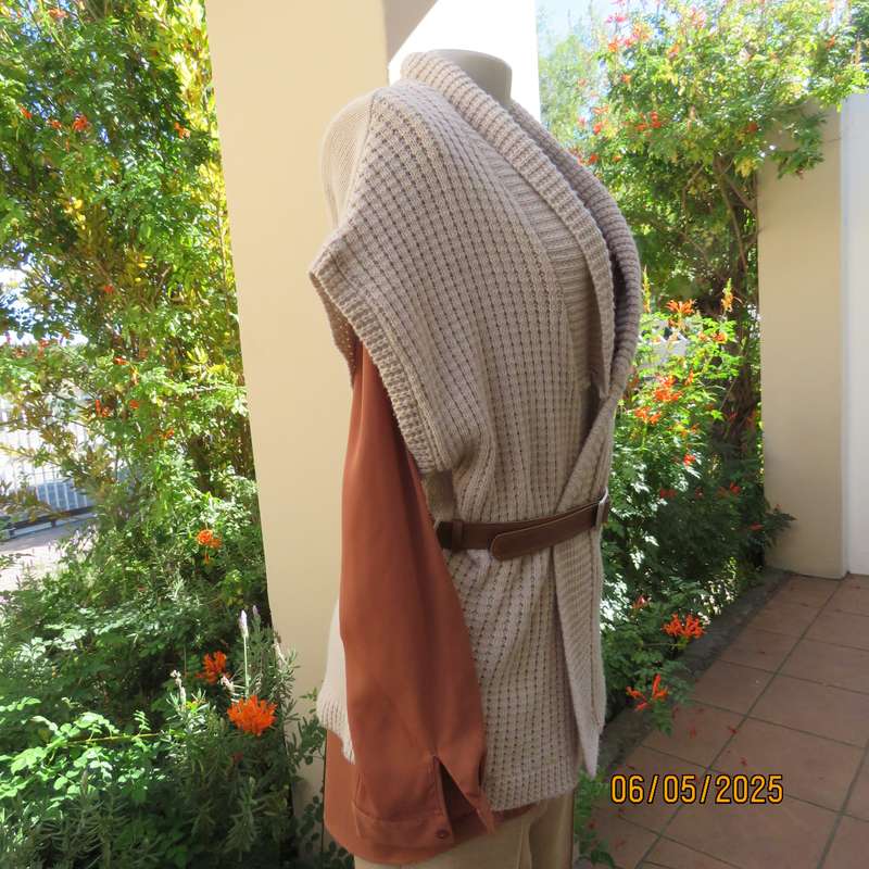 Beige fold over acrylic knit waistcoat style top. Front rib stitch. Size 42. As new.